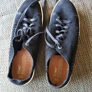 Toms black & white sneakers.